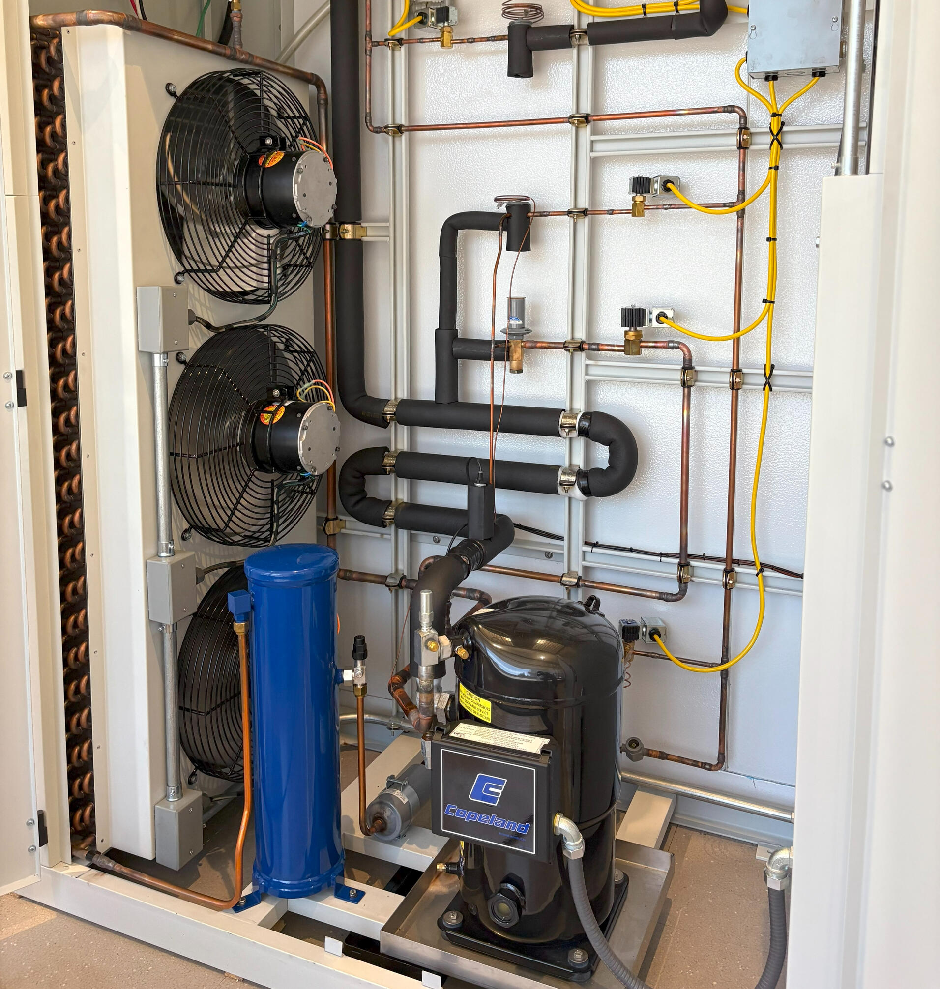 Compact Environmental Test Chamber with Yellow Trim A sleek, gray environmental test chamber with a yellow trim and front-facing control panel, designed for precise testing applications. The chamber features a windowed door for monitoring and is set against a blue gradient background.